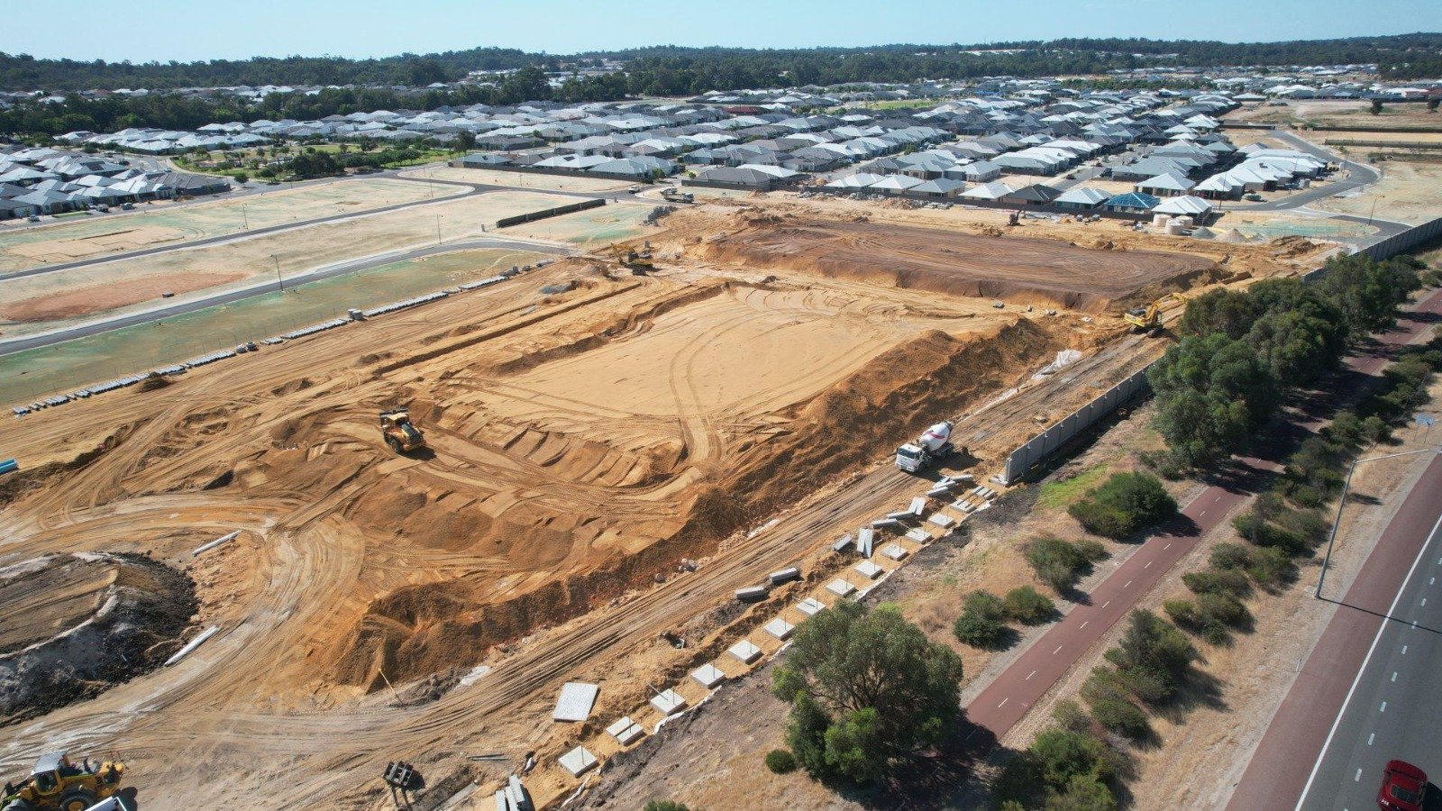 Bulk earthmoving machinery representing Land Development